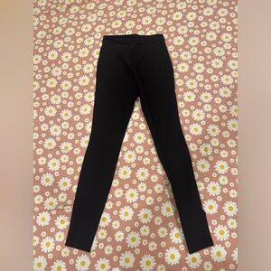 Skin Tight stretchy high waisted pleated black pants.